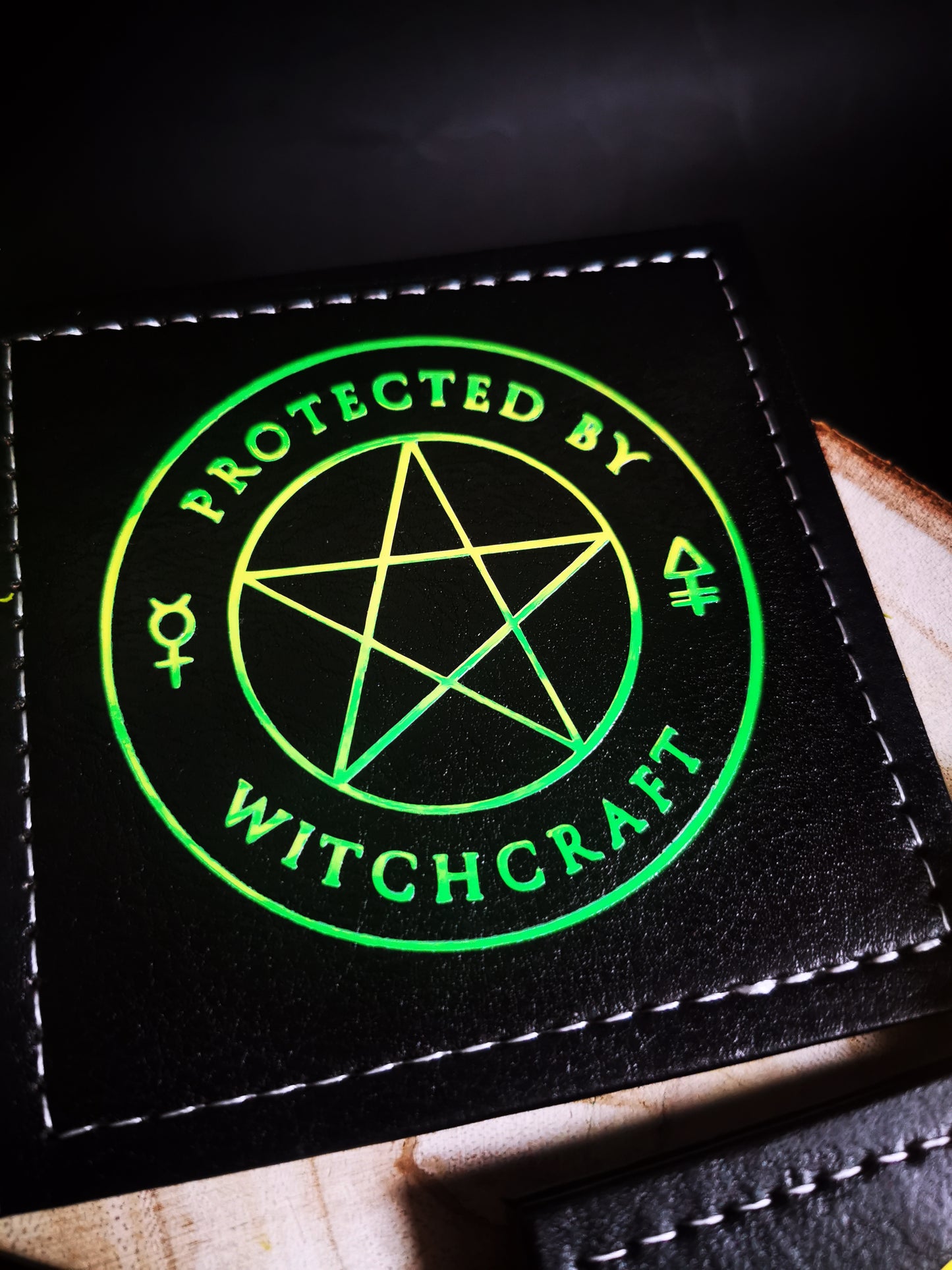 “Protected by Witchcraft” Coasters Glow in the Dark